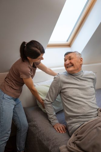elderly-person-being-taken-care-by-female-caretaker