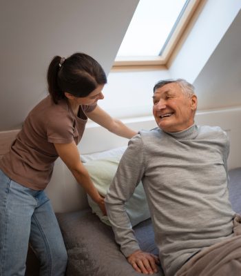 elderly-person-being-taken-care-by-female-caretaker