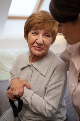 female-nurse-taking-care-elderly-person (1)
